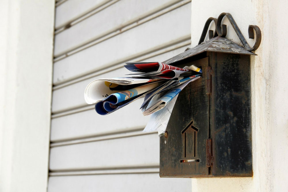 mail box full of direct mail pieces